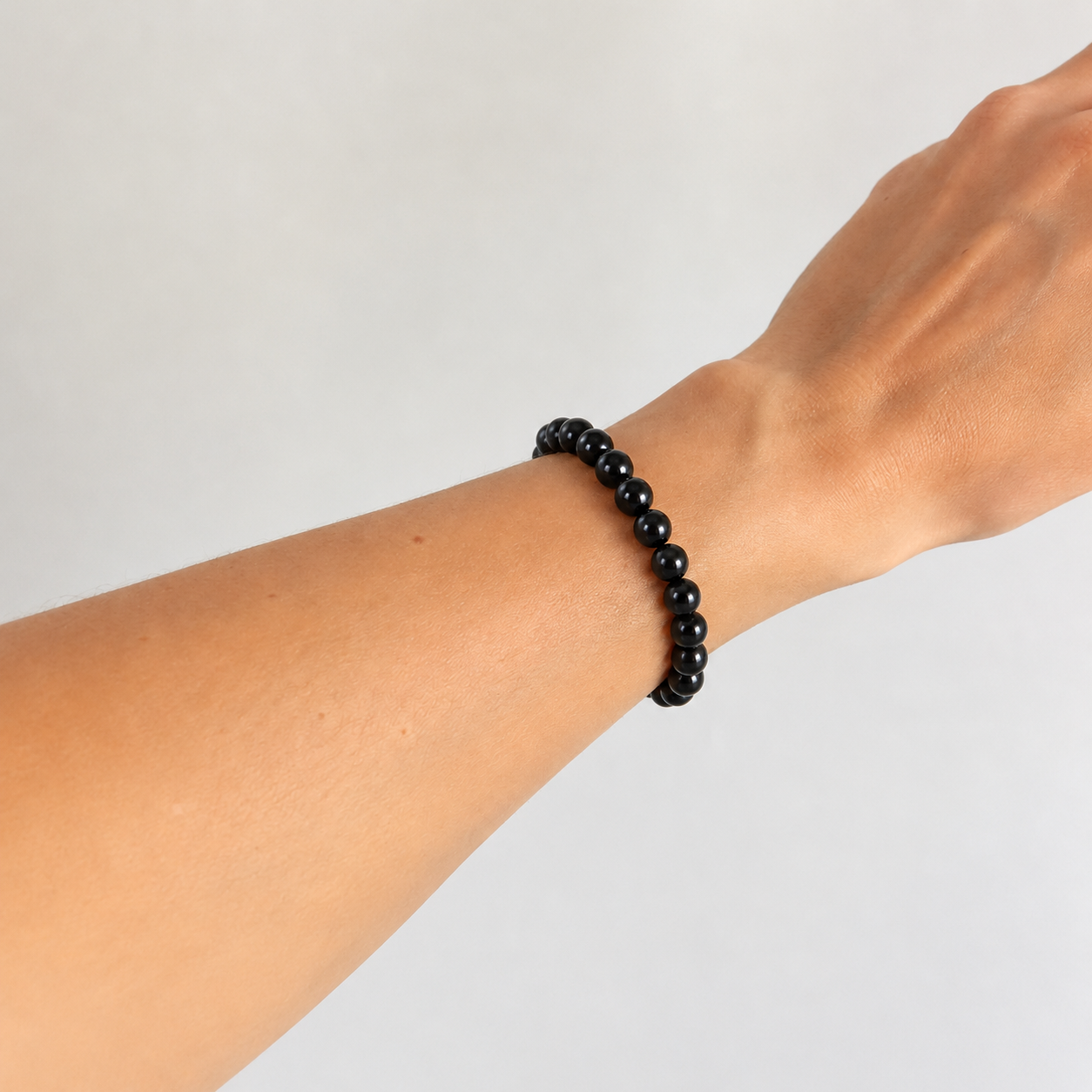 Close-up of the black obsidian beads of the feng shui bracelet