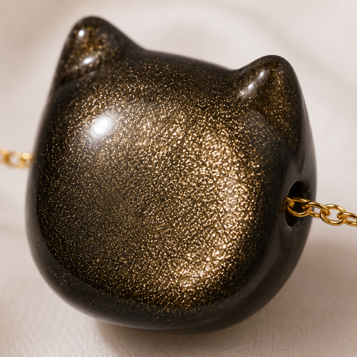 Detail of the natural gold sheen obsidian pendant