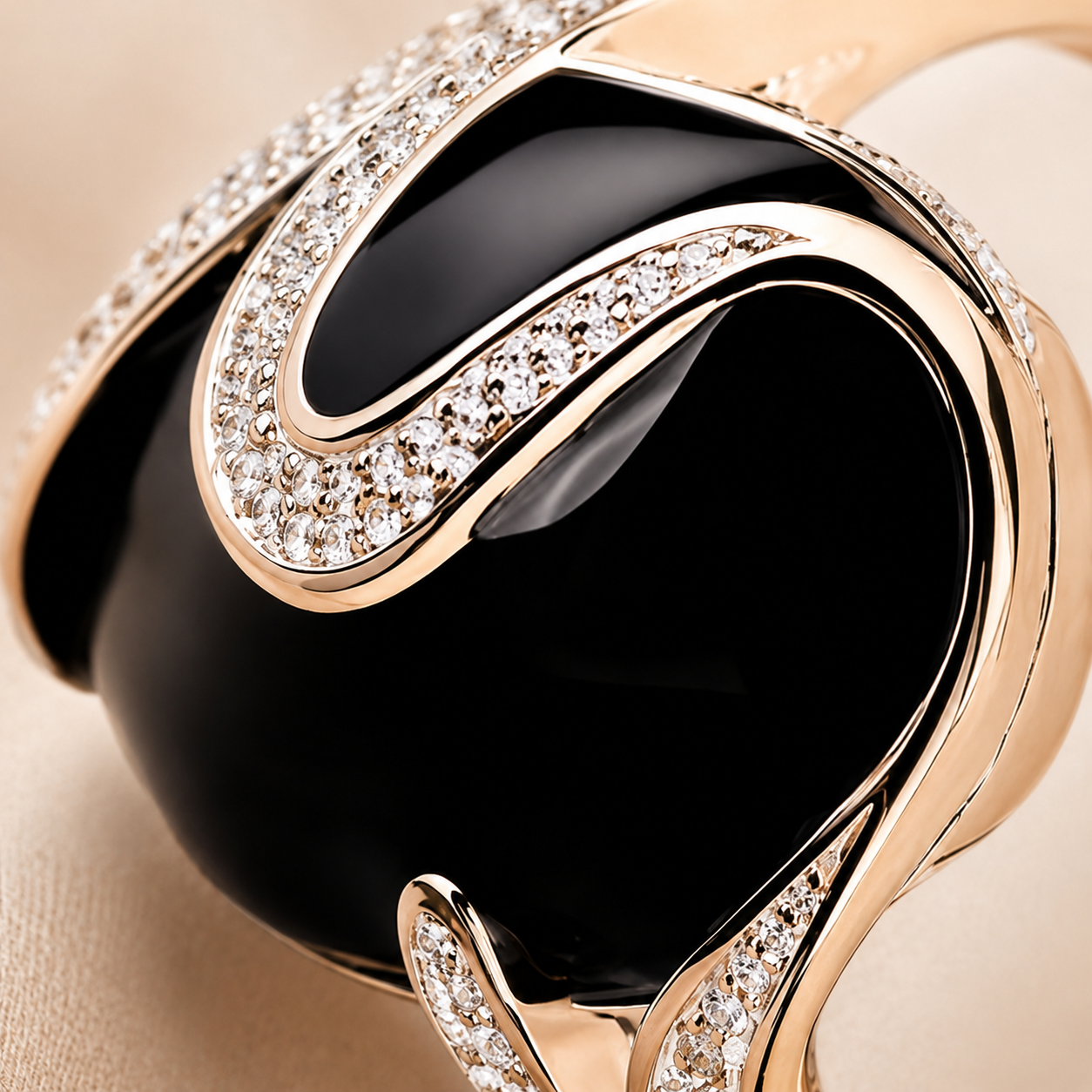 Close-up of the black obsidian ring and its gold setting