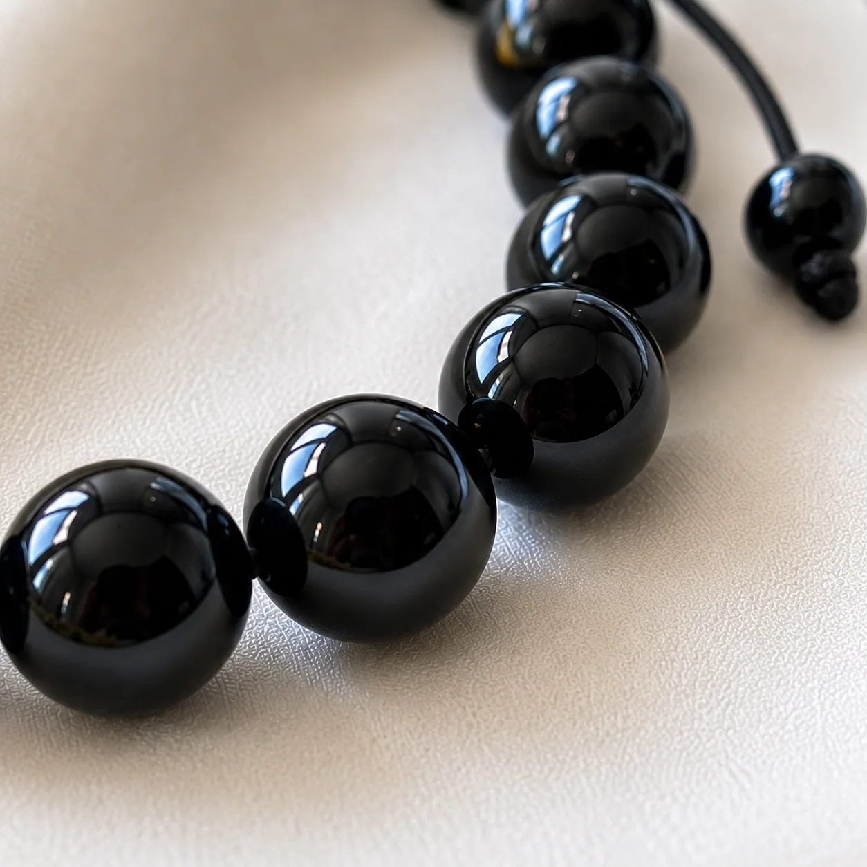 Close-up of the natural black obsidian beads