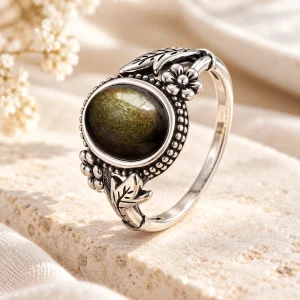 Bague en argent à feuillage asymétrique, cabochon ovale d'obsidienne dorée