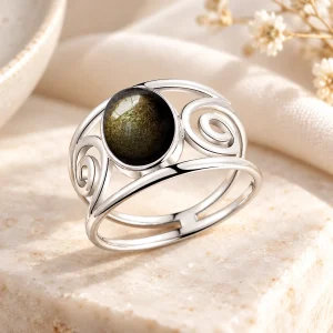 Bague large en argent ajourée de spirales, cabochon d'obsidienne dorée intégré