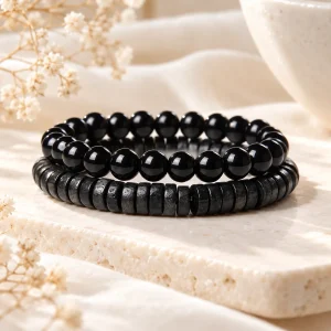 Duo de bracelets, un rang de perles rondes d'obsidienne et un rang de rondelles plates d'hématite