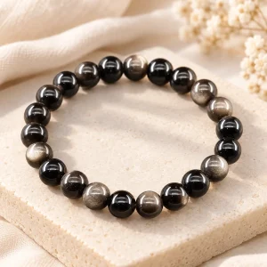 Bracelet obsidienne argentée et noire, perles de 8 mm alternées sur fil élastique