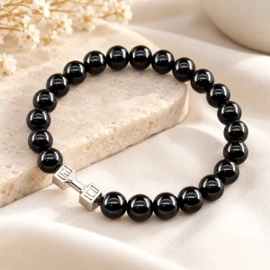 Bracelet obsidienne 8 mm avec une petite haltère en acier inoxydable