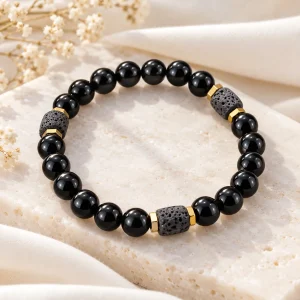Bracelet 8 mm mêlant obsidienne polie et pierre de lave poreuse, rondelles dorées