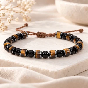 Bracelet à tonneaux d'œil de tigre, rondelles d'hématite et perles d'obsidienne, cordon brun