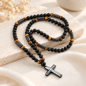 Chapelet de perles d'obsidienne mate et d'œil de tigre, croix d'hématite en pendentif