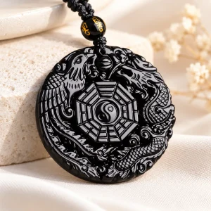 Pendentif rond en obsidienne, dragon et phénix sculptés autour des huit trigrammes