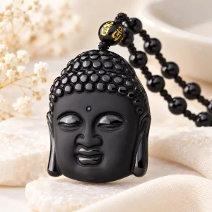 Pendentif tête de Bouddha en obsidienne, sculptée en volume